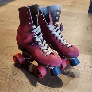 Vintage Red Roller Skates with Butterfly Detail